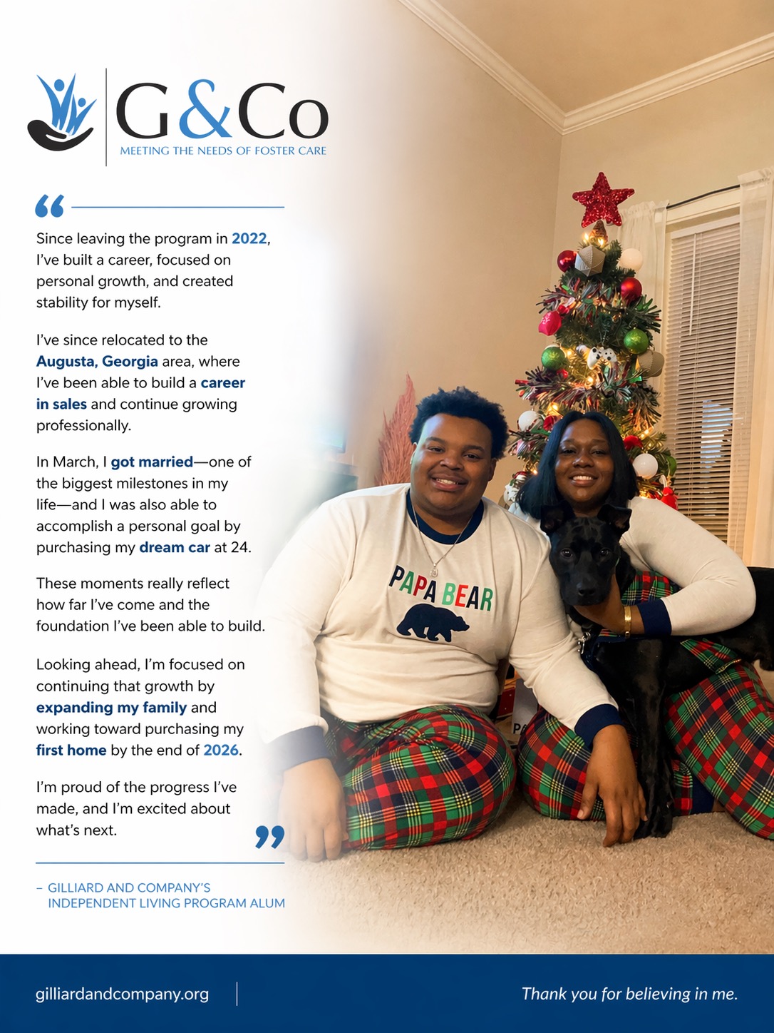 Two people sit on a couch in front of a decorated Christmas tree, smiling and wearing festive pajamas.